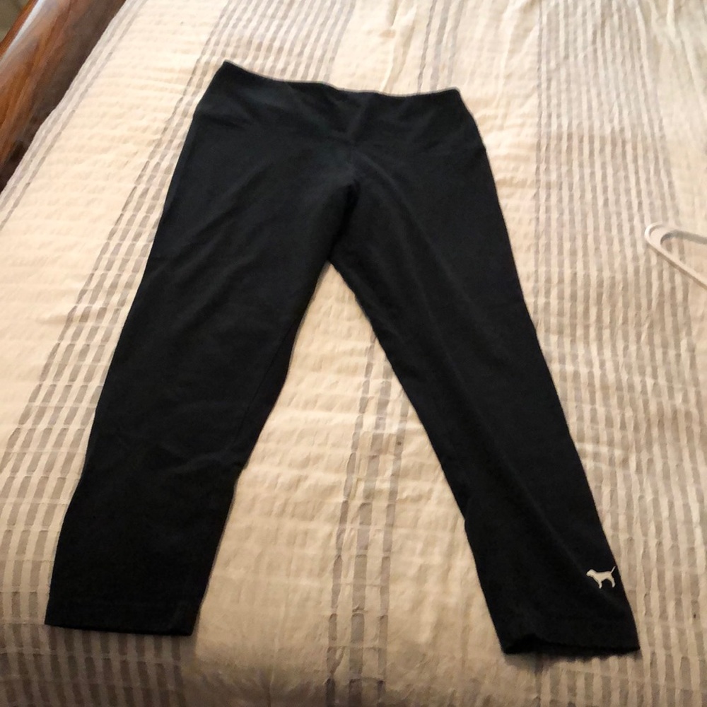Plain Black Victorias Secret PINK leggings with dog logo on left ankle